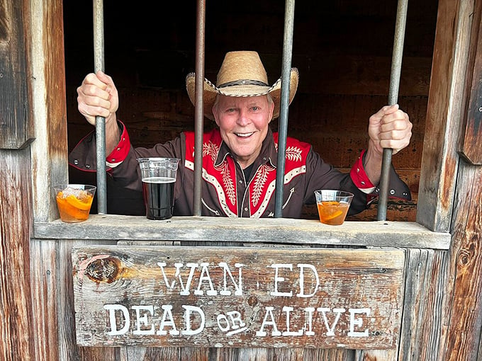 Jailhouse rock, indeed! This cowboy's grin suggests the "hoosegow" might be the best seat in the house.