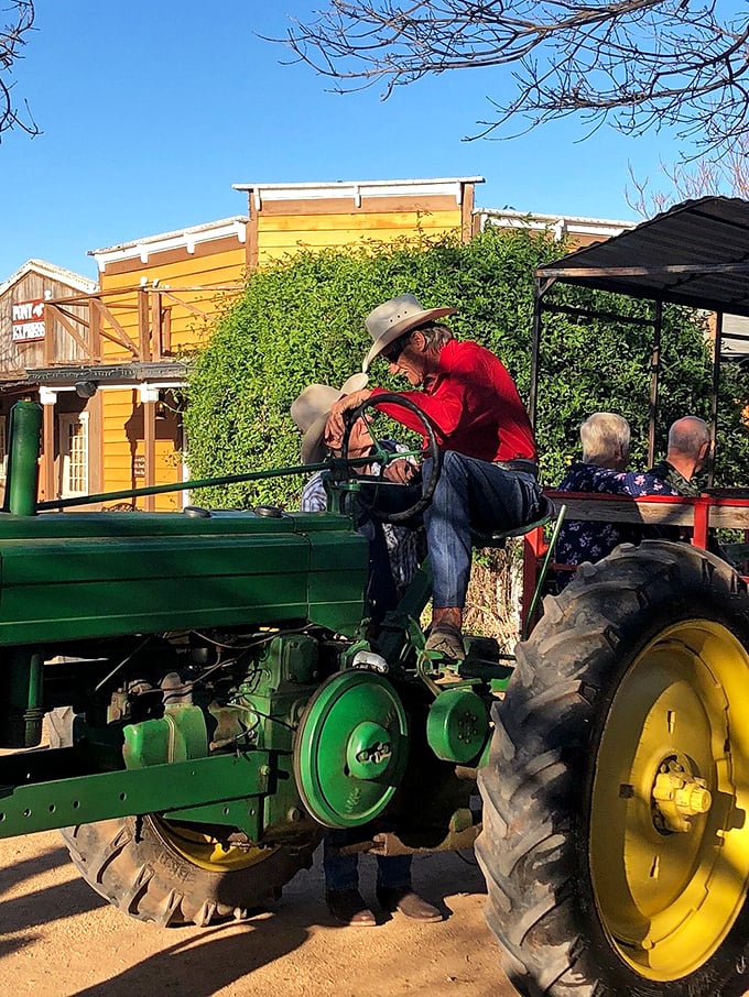 All aboard the green machine! This cowboy's traded his trusty steed for some serious horsepower.