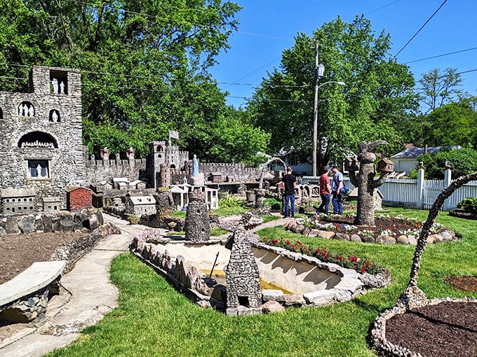 "Honey, can we move here?" Visitors marvel at the rock garden's miniature wonders, proving good things really do come in small packages.