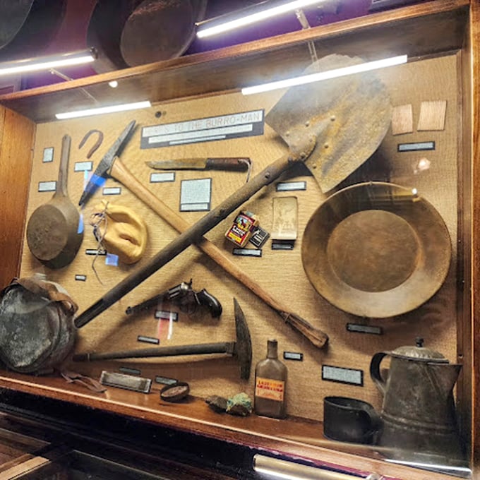 Tools of the trade or relics of rowdy times? This display's got more stories than a campfire session with Calamity Jane. Each item's a chapter in the Wild West saga.