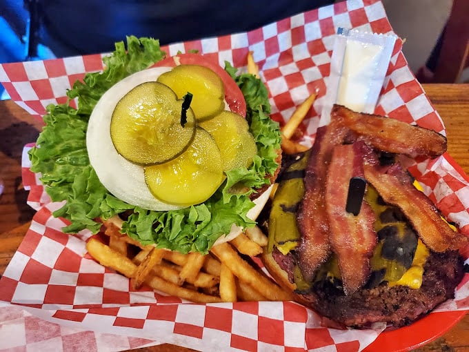 Now that's what I call a burger! Stacked higher than a cowboy's tall tales, this bacon-loaded beauty is a carnivore's dream come true.