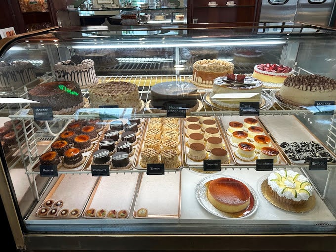 Sweet temptation behind glass. This pastry case is a treasure chest of sugary delights that would make Willy Wonka jealous.