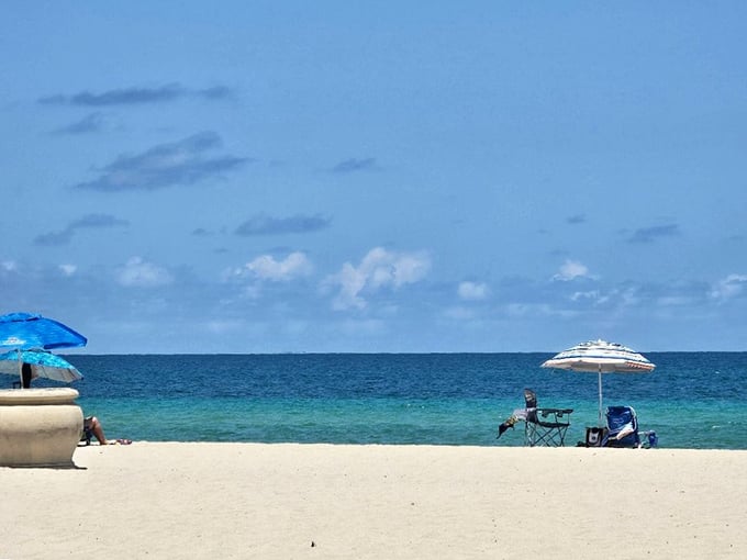 Beach day bliss: A few umbrellas, an expanse of sand, and endless ocean views - sometimes the simplest pleasures are the best.