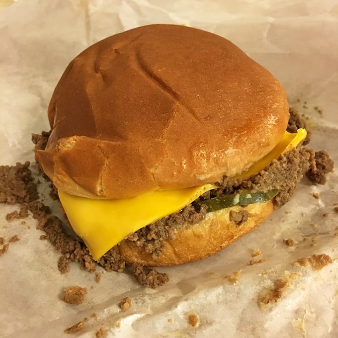 Behold, the Super Cheeseburger! It's not just a meal, it's a monument to American ingenuity. Napkins at the ready, folks!