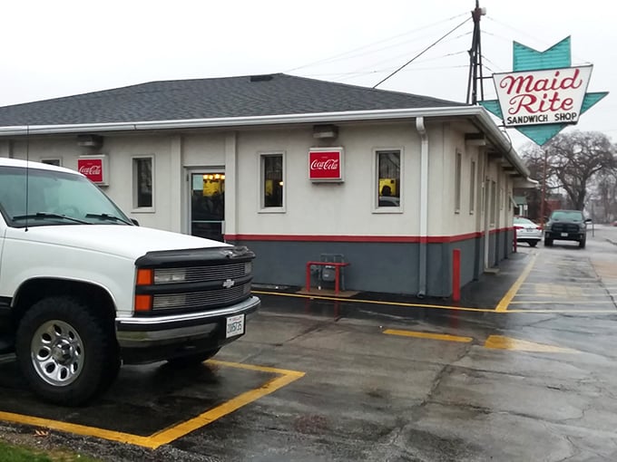 Rain or shine, the neon glows! This late-night beacon promises comfort food that'll warm you up faster than a bear hug from grandma.