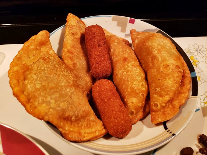 Empanadas and croquetas: the dynamic duo of Cuban cuisine. These crispy delights are like a warm, savory hug for your mouth.