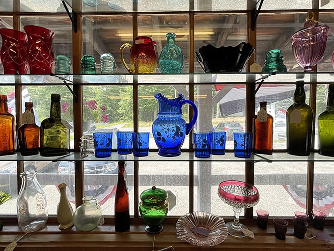 A rainbow of vintage glassware catches the light, creating a kaleidoscope effect. It's like staring into the world's most beautiful (and breakable) crystal ball.