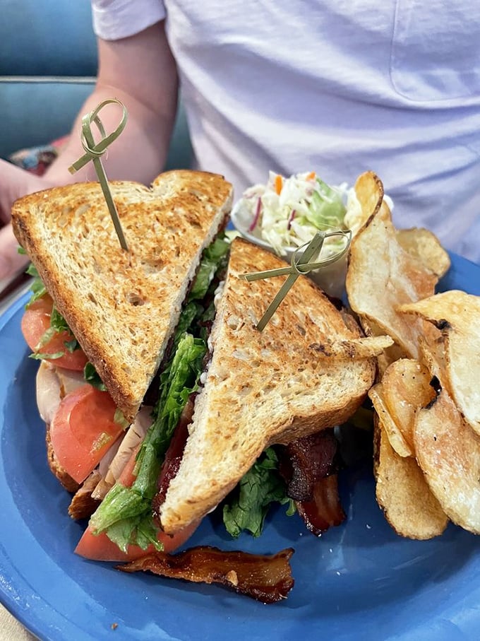 This sandwich isn't just stacked, it's a skyscraper of flavor. Empire State Building, meet your delicious doppelganger.