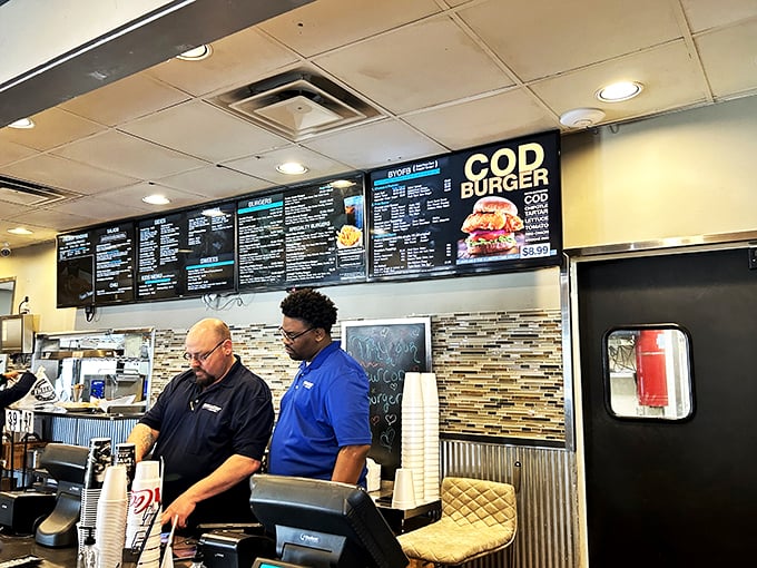 The burger dream team! These dedicated staff members are the unsung heroes behind your perfect patty. Give them a round of applause (and maybe a tip).