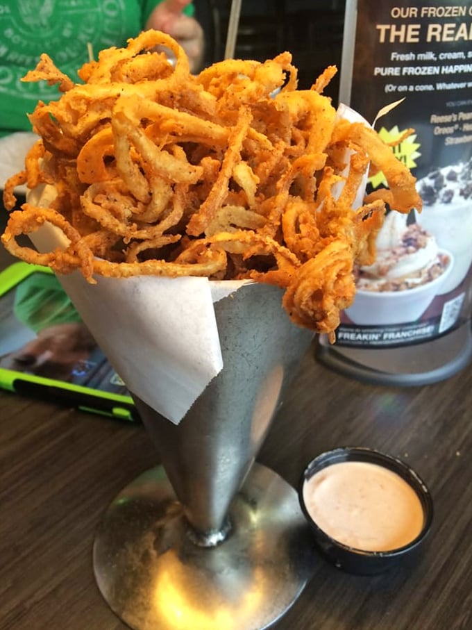 Onion ring tower of power! These crispy, golden straws are like edible Jenga – deliciously fun to eat, but they might topple if you're not careful.