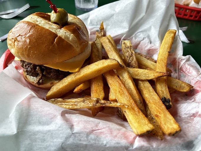 Hold onto your hats, folks! This isn't just a burger, it's a towering monument to the art of hand-held deliciousness.