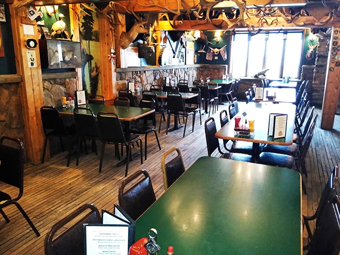 Table for two... thousand antlers, please! This dining area is like a cozy cabin crossed with a natural history exhibit.