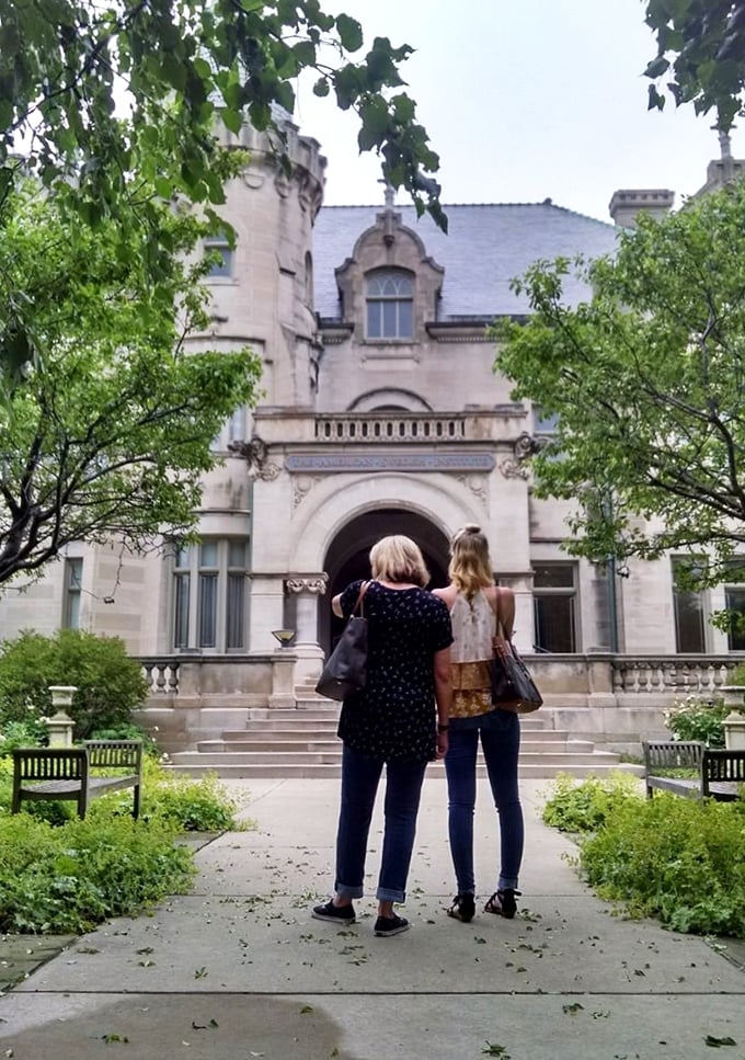 "Do you think they have Swedish Fish in there?" Two visitors ponder life's important questions at the mansion's entrance.