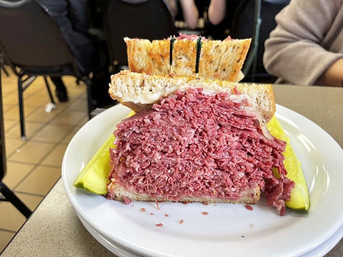 Holy cow! This isn't just a sandwich; it's a skyscraper of savory bliss. Slyman's corned beef defies both gravity and restraint.