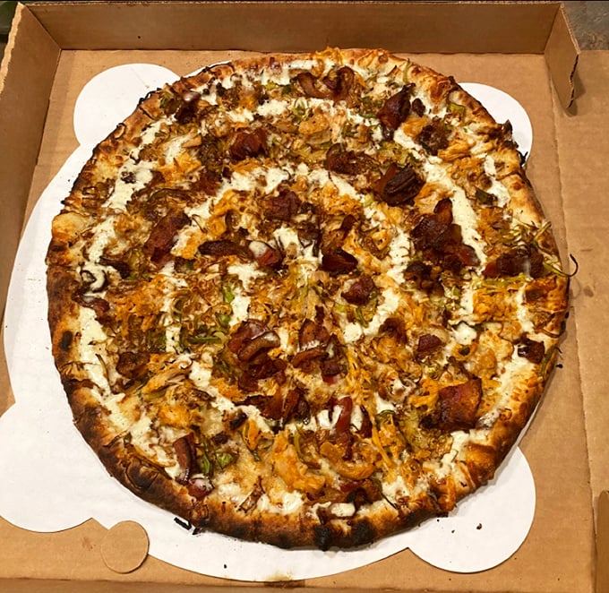 Ladies and gentlemen, we have a winner! This pizza looks so good, it might just make you forget about that diet you were planning to start... tomorrow.