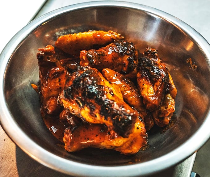 These wings aren't just finger-lickin' good, they're practically finger-proposin' good. Sticky, spicy, and glistening with flavor - resistance is futile!