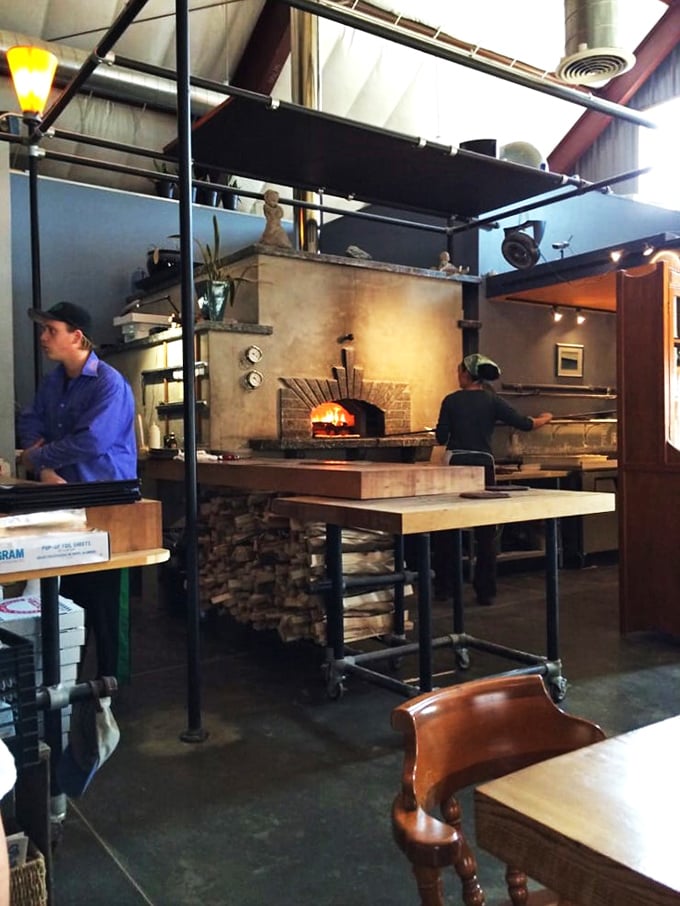 The pizza wizards at work! These skilled artisans are the unsung heroes behind your slice of heaven. Watch them transform simple ingredients into edible magic.