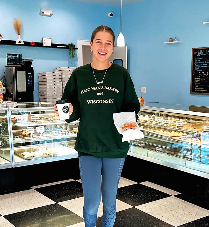 The face of happiness! This friendly staff member is ready to guide you through Hartman's sugary wonderland. Trust her – she knows where the good stuff is.