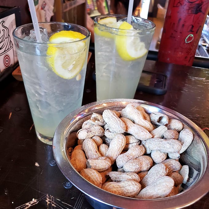 The dynamic duo of refreshment! AJ Bombers' peanuts and lemonade are the Batman and Robin of bar snacks.