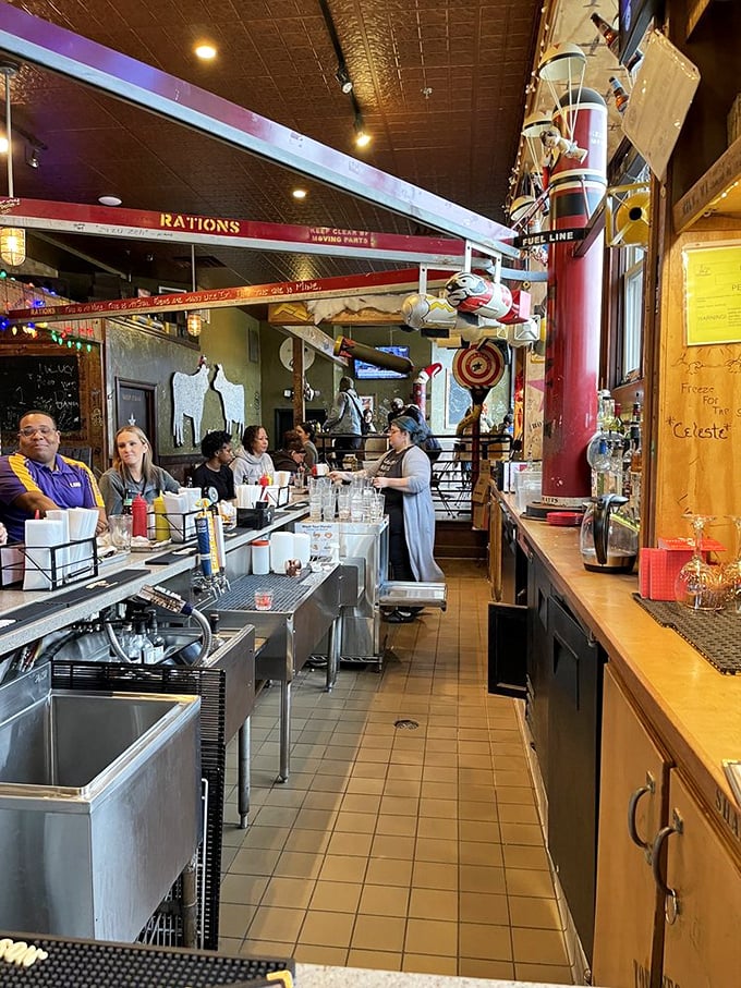 Where the magic happens! AJ Bombers' bustling counter is like watching a delicious ballet of burgers and shakes.