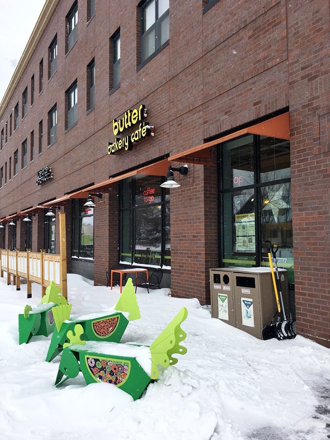 Snow-covered dinosaur benches guard the entrance. Inside, butter reigns supreme in this comfort food kingdom. 