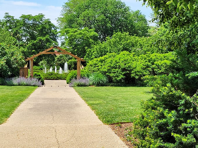 Where the grass is always greener! This serene scene, complete with arched gateway, promises a journey into botanical bliss. Photo credit: Bill Doering