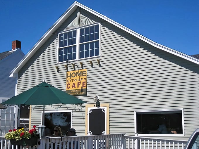 Cozy charm alert! This cafe's windows and inviting porch are like a warm hug for your soul.