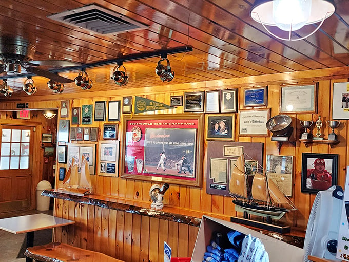 The walls tell stories of victories and catches, with Red Sox memorabilia and nautical treasures creating a museum of local pride. Photo credit: John Coons