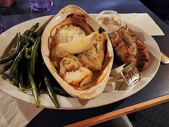 This isn't just dinner - it's a seafood masterpiece served with perfectly seasoned green beans and a golden-brown baked potato. Photo credit: Shailesh J.