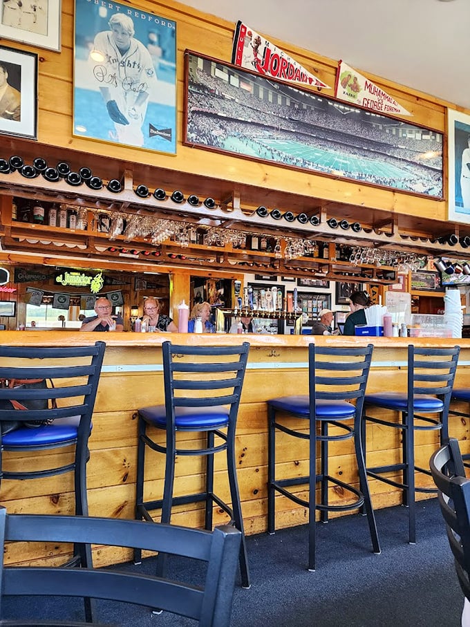 Pull up a seat at this friendly bar, where Boston sports history meets harbor views and cold brews. Photo credit: Alexander Shyshla