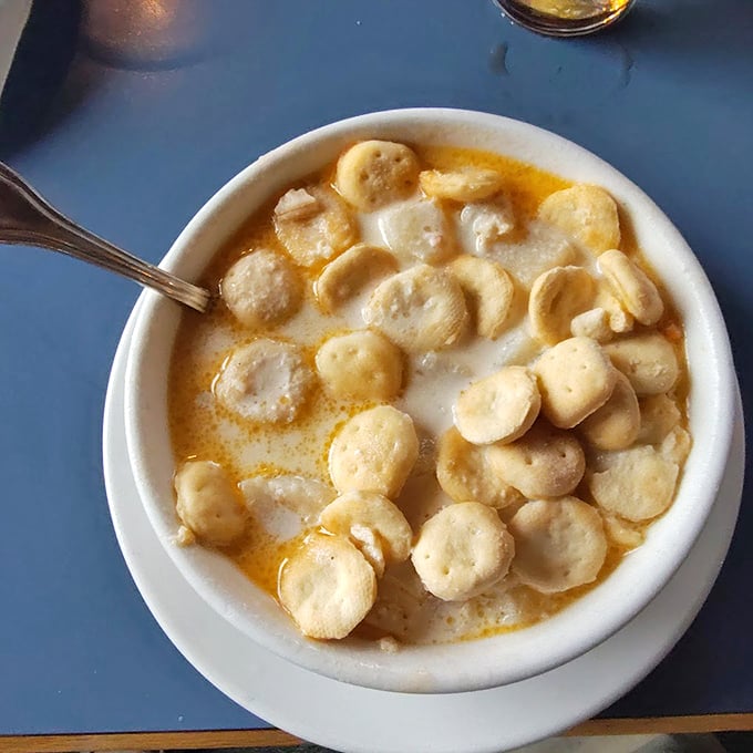 Oyster crackers float like tiny boats in this creamy sea of classic New England clam chowder. Photo credit: Charley Bryant