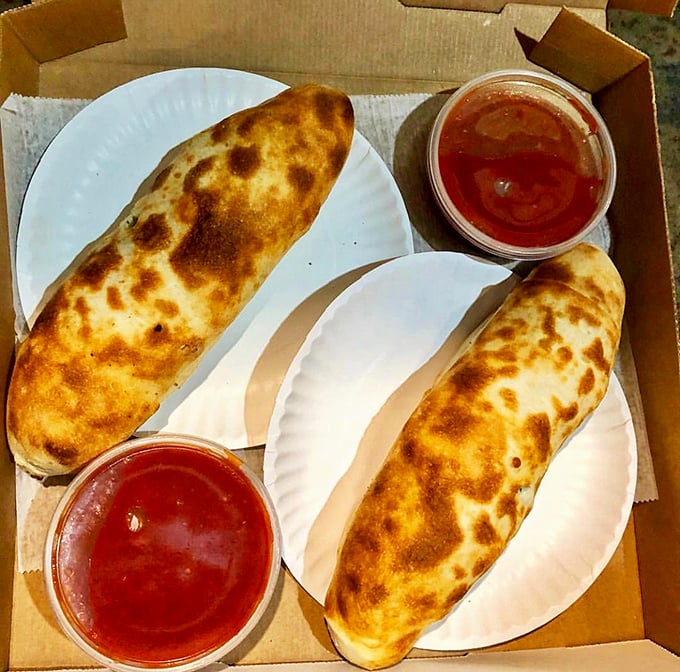 Behold the stromboli, the unsung hero of Italian cuisine! It's like a pizza decided to get all rolled up with nowhere to go but your belly.