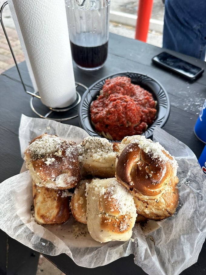 Garlic knots that could make a vampire reconsider his life choices. Buttery, garlicky perfection that's worth every breath mint.