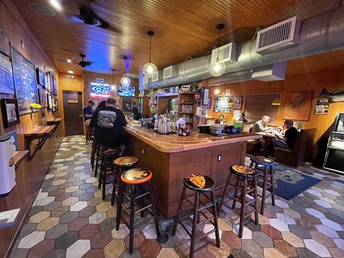 Step into seafood paradise! Frenchy's cozy interior, with its wood-paneled walls and nautical touches, feels like your favorite beach shack got a charming makeover.