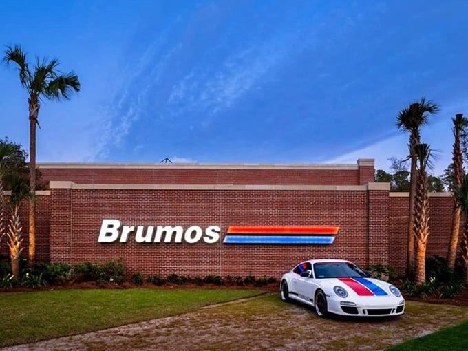 The Brumos sign: A beacon of hope for car lovers everywhere. It's like the Bat-Signal, but for gearheads.