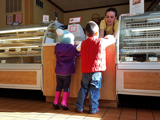 Little hands, big dreams! These young customers are living proof that good taste starts early at Herb's Bakery.