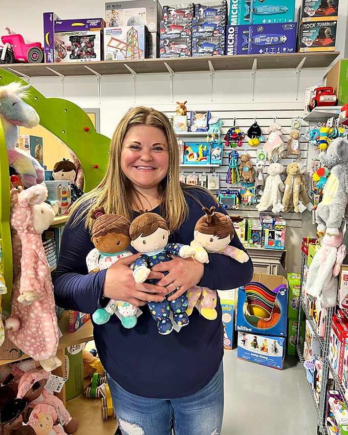 Toy whisperer at work! This enthusiastic staff member knows that matching the right toy to the right child is an art form.