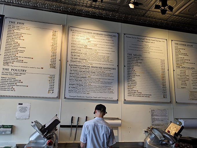 Behold, the sacred scrolls of sandwich artistry! This menu board is a roadmap to culinary bliss, offering more options than a Netflix queue. Choose wisely, young Padawan of pastrami.