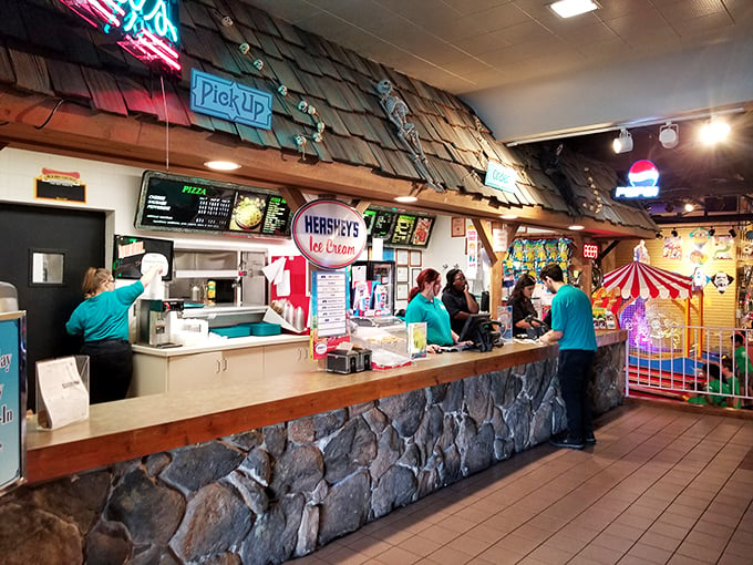 "Scream for ice cream at the Ghoul's Galley! Where else can you get a scoop of 'Frankenstein Fudge' or 'Werewolf Whiskers'? Just don't ask what's in the 'Mystery Flavor'..."