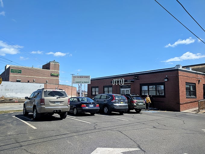 OTTO's parking lot: The starting line for your pizza pilgrimage. Rev up your appetite, folks - cheesy nirvana awaits just steps away!