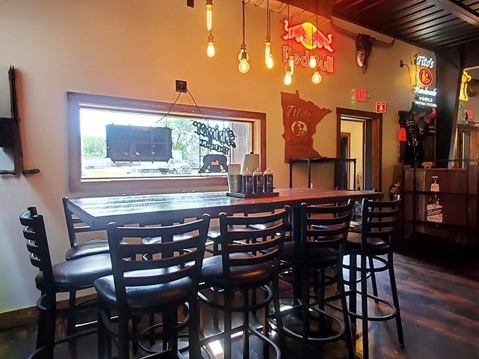 Step into barbecue paradise! This cozy interior, with its warm lighting and rustic charm, feels like a hug for your soul (and soon, your stomach).