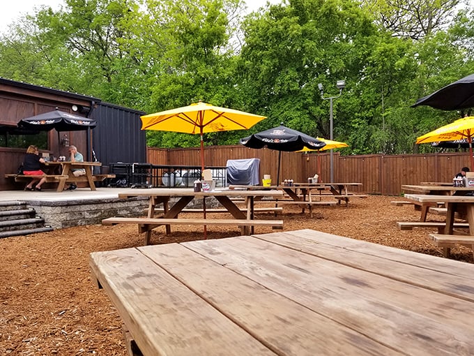 Outdoor seating that's pure Minnesota magic! Enjoy your BBQ feast under the trees – it's like a picnic, but with better food.