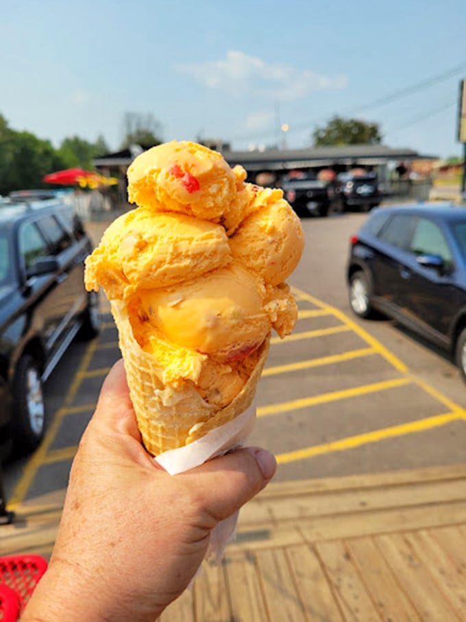 Ice cream scoops bigger than Paul Bunyan's footprint! This cone is the Everest of frozen treats.