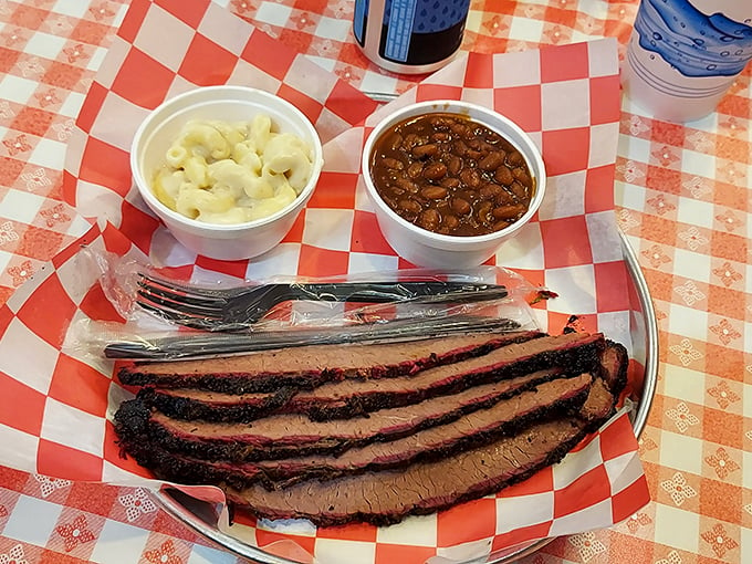 Brisket so tender, it practically slices itself. Paired with creamy mac and cheese and baked beans, it's a plate that screams "comfort food royalty."