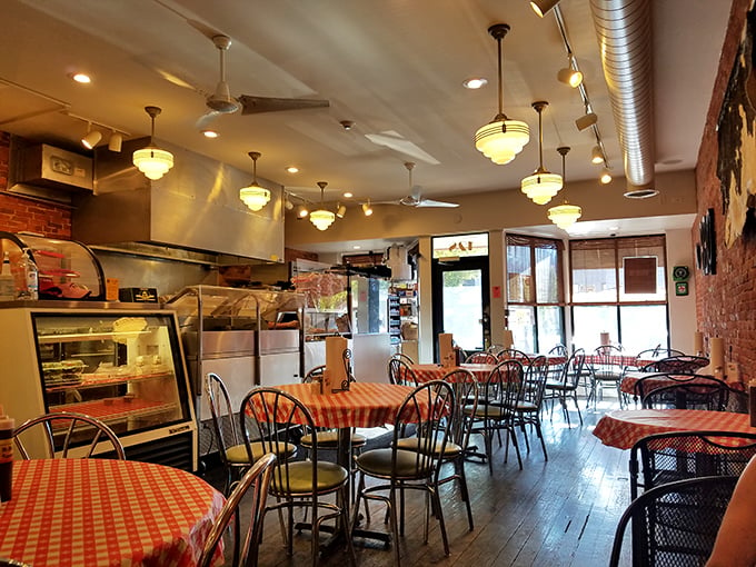 Exposed brick, pendant lights, and the promise of meaty delights. This dining area isn't just a room; it's a stage set for BBQ bliss.