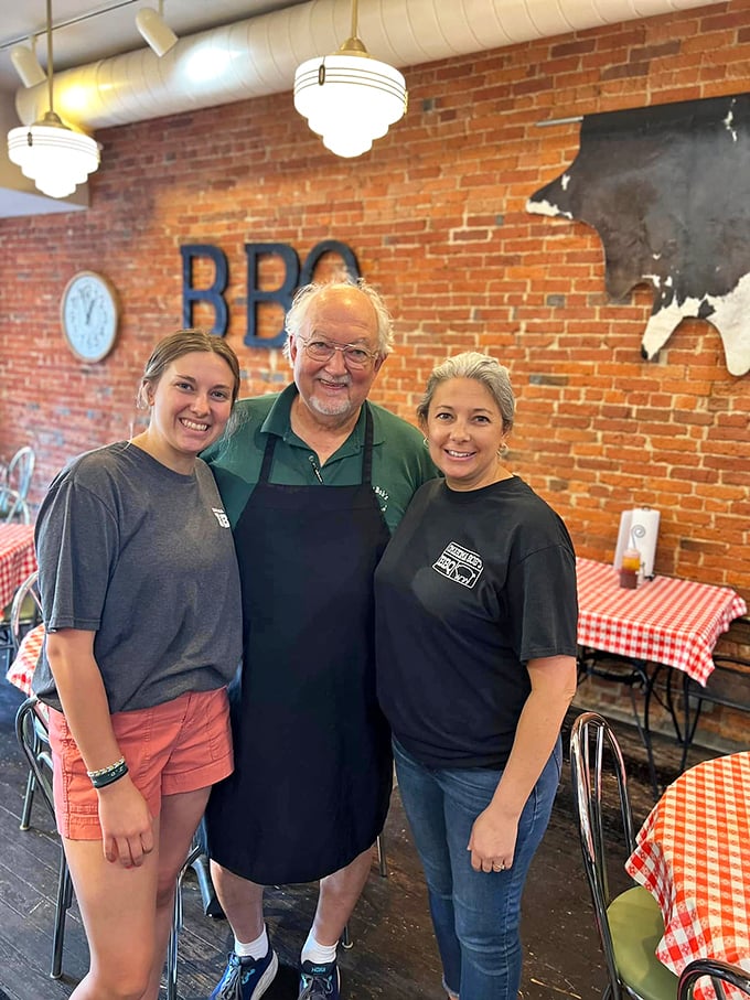 The faces behind the flavor! These BBQ maestros aren't just staff; they're the unsung heroes of your meat-induced happiness.