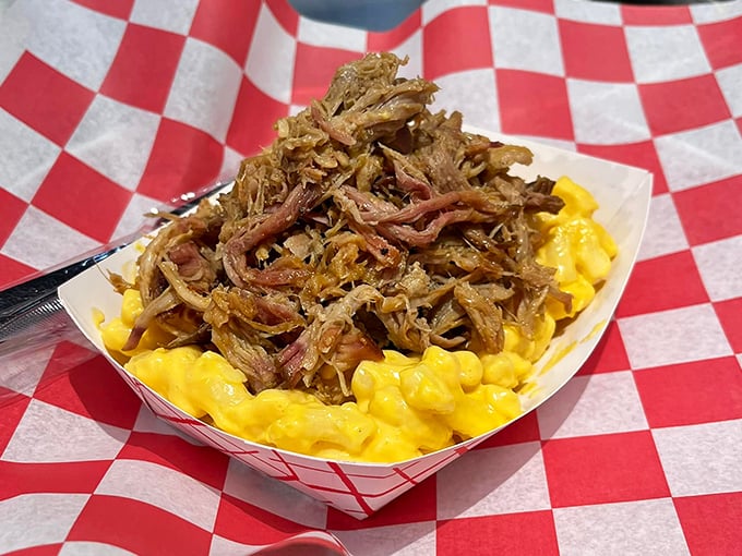 Mac and cheese gets a meaty makeover! This isn't just comfort food; it's a hug for your taste buds topped with a pulled pork serenade.