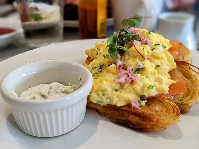 Salmon and scramble on a croissant: A breakfast sandwich so fancy, it deserves its own red carpet entrance.