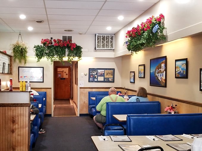 Step inside and let the blue booths embrace you like the Aegean Sea. This cozy interior whispers tales of family recipes and Greek hospitality.