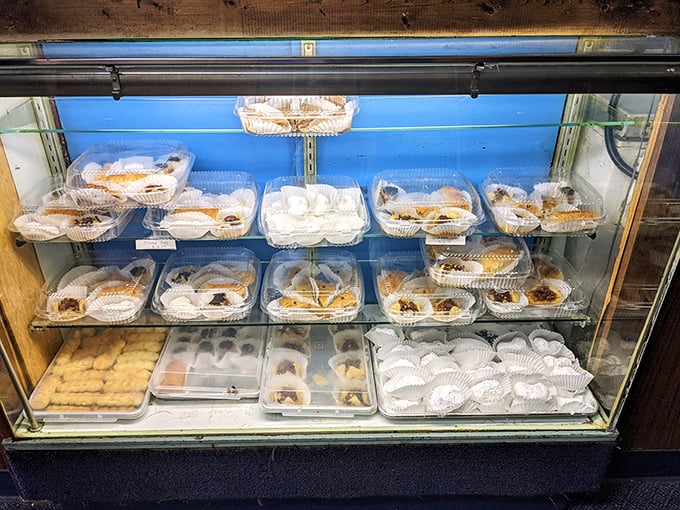 A display case that's basically Willy Wonka's factory for grown-ups. Each pastry is a sweet siren song, impossible to resist.